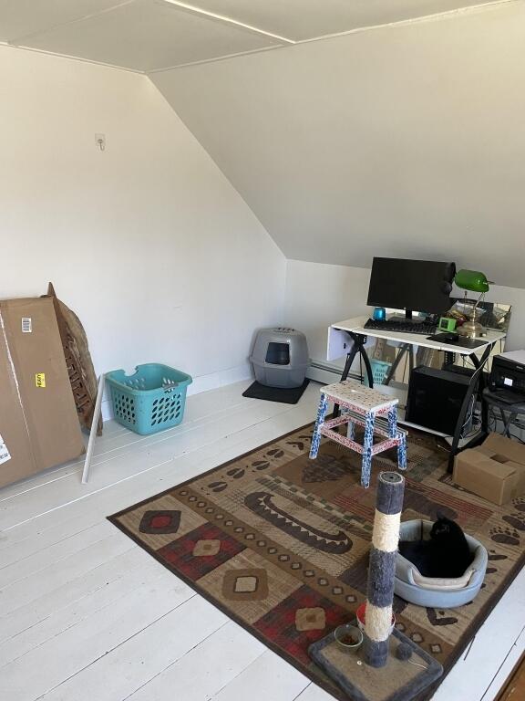 home office featuring vaulted ceiling