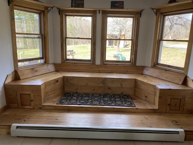 relaxing sauna / steam room featuring healthy amount of natural light