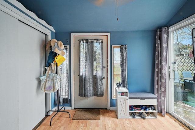 entryway with wood finished floors and baseboards