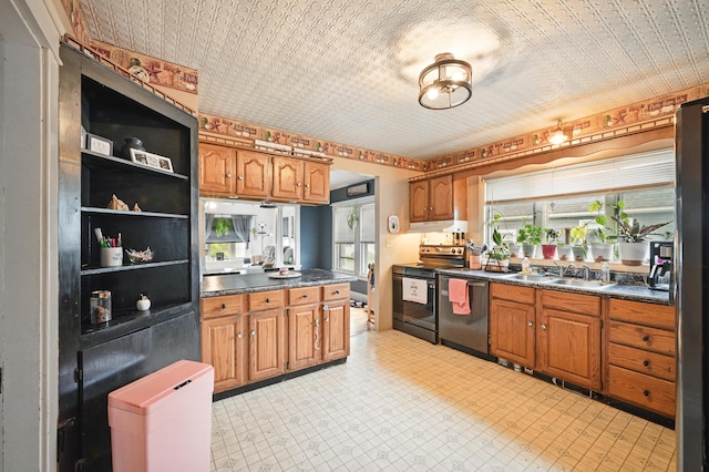 kitchen featuring black / electric stove, dishwashing machine, dark countertops, brown cabinets, and under cabinet range hood