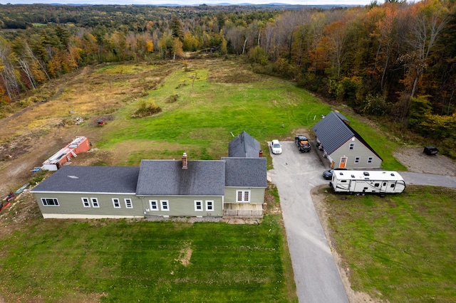 view from above of property with a heavily wooded area