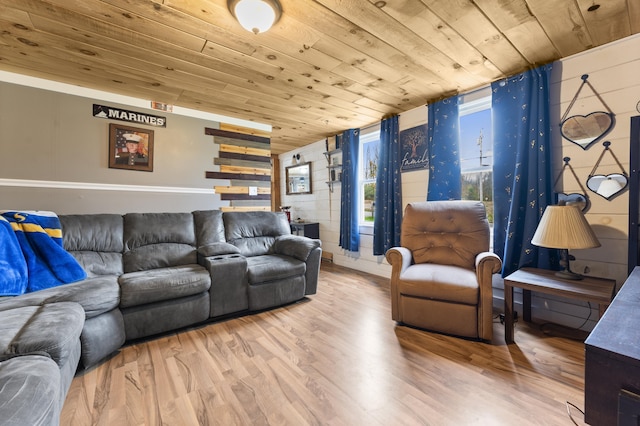 living area featuring wood ceiling and wood finished floors