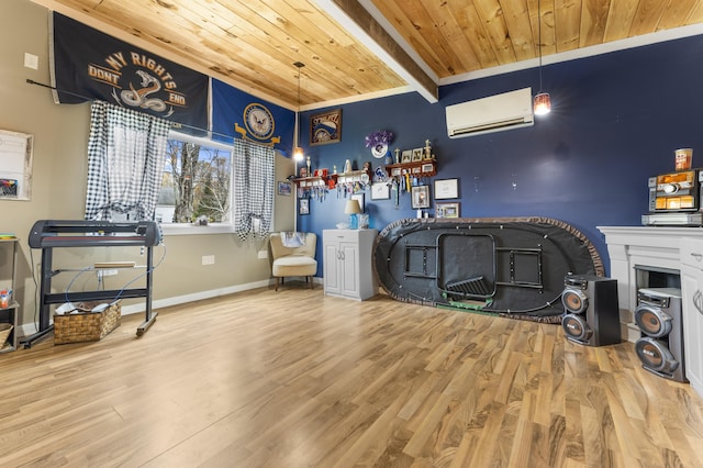 miscellaneous room with wooden ceiling, a wall unit AC, wood finished floors, beam ceiling, and baseboards