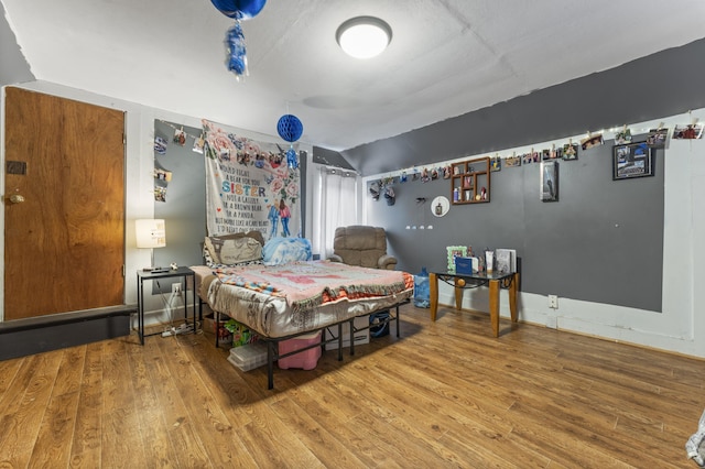 bedroom featuring wood finished floors