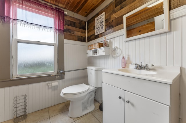 half bathroom featuring tile patterned flooring, wooden walls, toilet, healthy amount of natural light, and wooden ceiling
