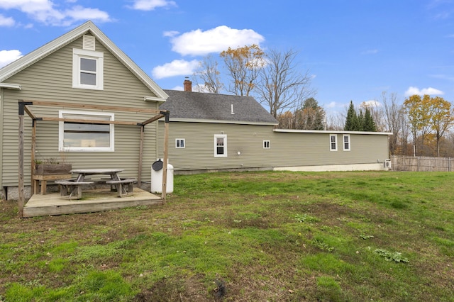 back of property with a chimney