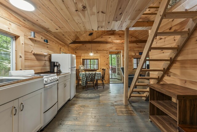 23 E Shore Dr, Greene, ME 04236 - kitchen featuring vaulted ceiling, wood walls, wood ceiling, white appliances, and healthy amount of natural light