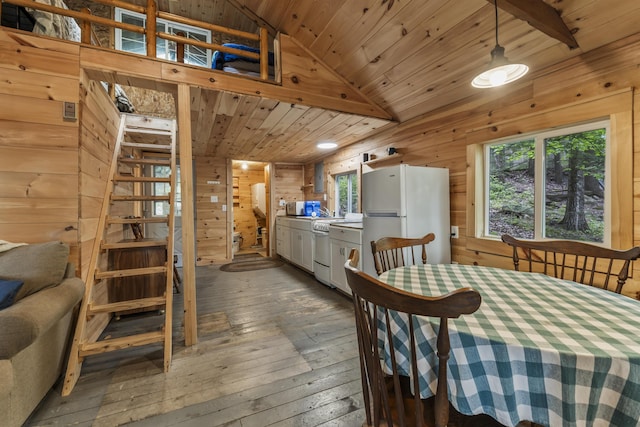 23 E Shore Dr, Greene, ME 04236 - dining room with hardwood / wood-style flooring, wood walls, stairway, wood ceiling, and lofted ceiling