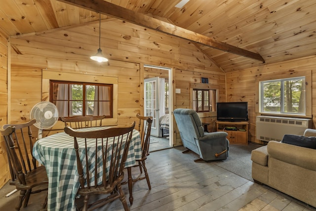 23 E Shore Dr, Greene, ME 04236 - dining room featuring radiator, wood walls, healthy amount of natural light, wood-type flooring, and wood ceiling