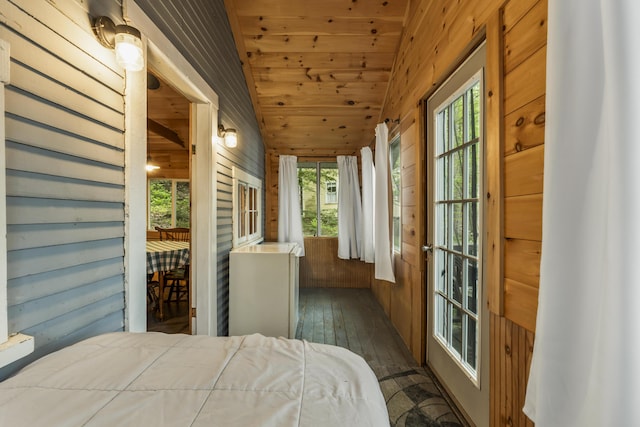 23 E Shore Dr, Greene, ME 04236 - bedroom featuring wood-type flooring, wooden walls, wooden ceiling, and vaulted ceiling