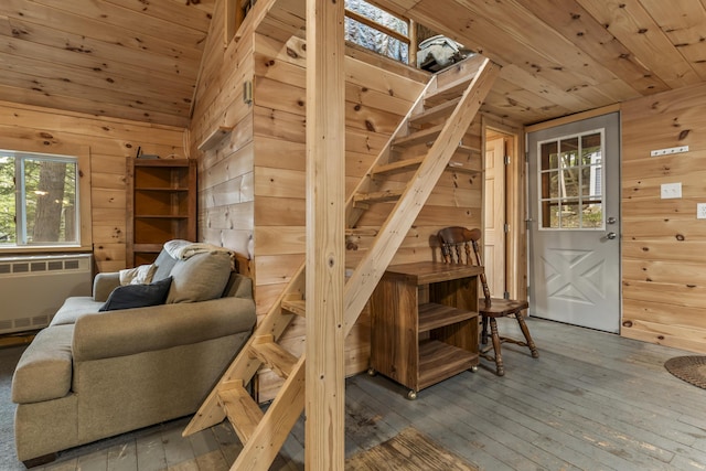 23 E Shore Dr, Greene, ME 04236 - living area featuring wood ceiling, wooden walls, radiator heating unit, hardwood / wood-style floors, and lofted ceiling