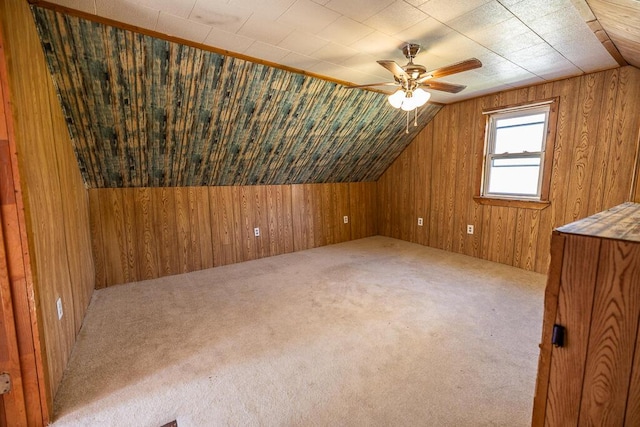 225 Todds Corner Rd, Saint Albans, ME 04971 - additional living space featuring wood walls, vaulted ceiling, a ceiling fan, and carpet