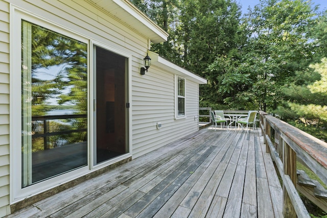 wooden deck featuring outdoor dining space