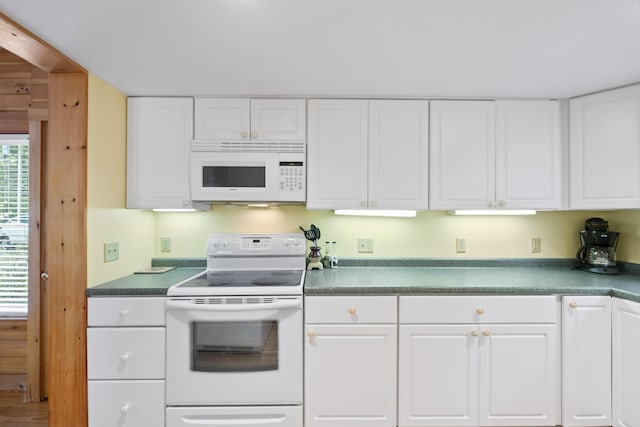 kitchen with white appliances and white cabinetry