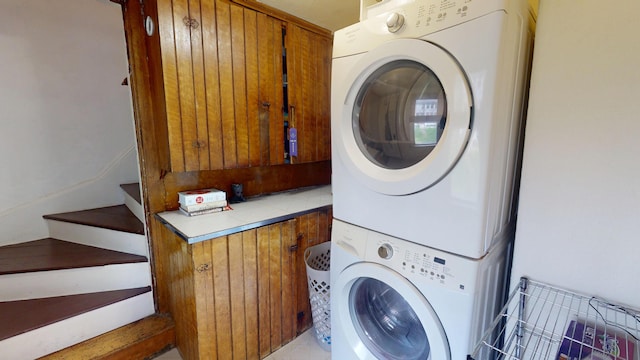 21 Fern St, Bangor, ME 04401 - washroom featuring stacked washer / drying machine and cabinet space