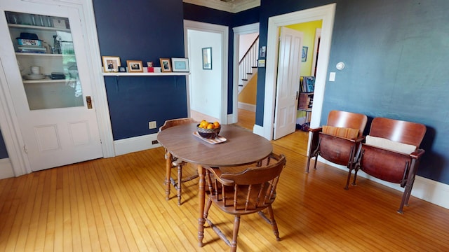 21 Fern St, Bangor, ME 04401 - dining room featuring light wood-style flooring and stairs
