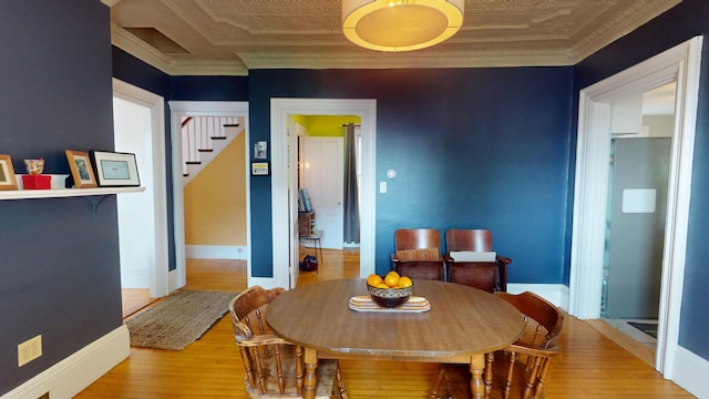 21 Fern St, Bangor, ME 04401 - dining space with stairway, an ornate ceiling, wood finished floors, and baseboards