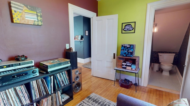 21 Fern St, Bangor, ME 04401 - bedroom featuring wood-type flooring, baseboards, and ensuite bath