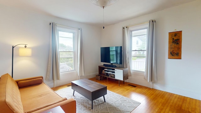 21 Fern St, Bangor, ME 04401 - living room featuring light wood finished floors and baseboards