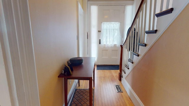 21 Fern St, Bangor, ME 04401 - doorway with stairway, wood finished floors, and baseboards