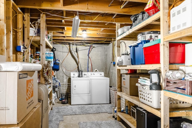 unfinished below grade area featuring washer and dryer