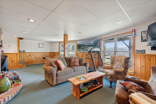 237 River Rd, Avon, ME 04966 - living area with wainscoting, a paneled ceiling, carpet, healthy amount of natural light, and wood walls
