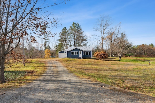 237 River Rd, Avon, ME 04966 - view of front of property featuring driveway, a front lawn, and metal roof