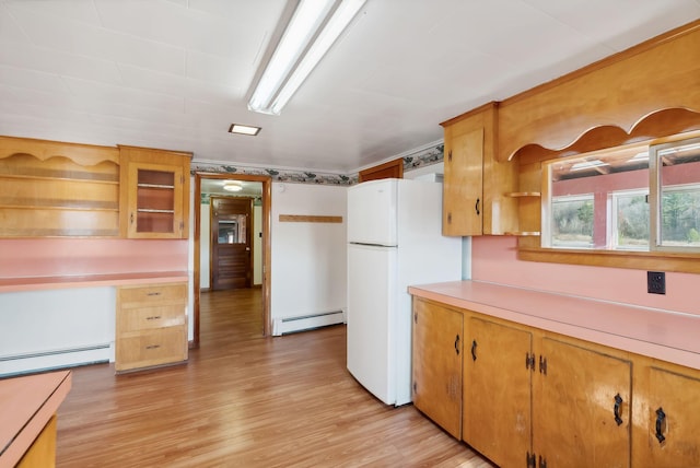 237 River Rd, Avon, ME 04966 - kitchen featuring baseboard heating, freestanding refrigerator, open shelves, light countertops, and a baseboard heating unit
