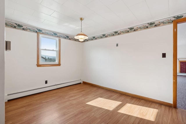 237 River Rd, Avon, ME 04966 - spare room with a baseboard radiator, light wood-style flooring, and baseboards