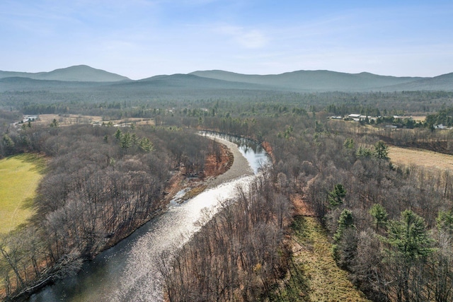 237 River Rd, Avon, ME 04966 - aerial view of property's location with a heavily wooded area and a water and mountain view