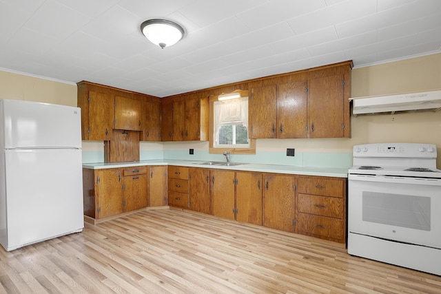 237 River Rd, Avon, ME 04966 - kitchen with white appliances, under cabinet range hood, brown cabinetry, and ornamental molding