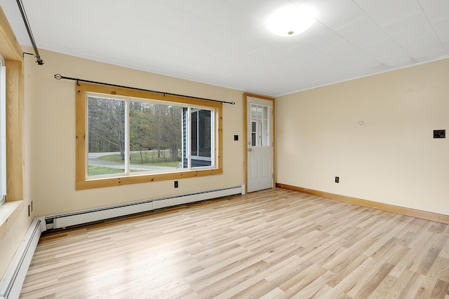 237 River Rd, Avon, ME 04966 - unfurnished room featuring baseboard heating, wood finished floors, and baseboards