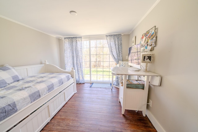 bedroom featuring dark wood finished floors and ornamental molding