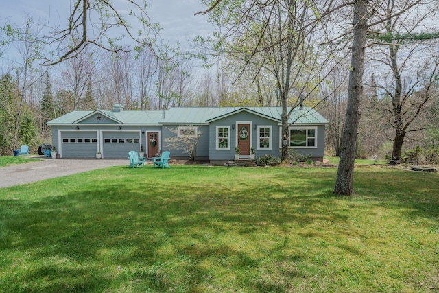 single story home featuring a garage, dirt driveway, metal roof, and a front yard