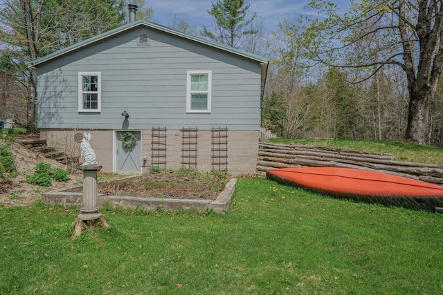 view of property exterior featuring a yard