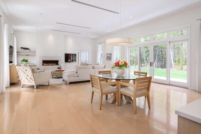 3 Bristol Ln, York, ME 03909 - dining space featuring healthy amount of natural light, a fireplace, light wood finished floors, and recessed lighting