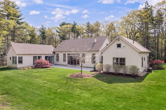 3 Bristol Ln, York, ME 03909 - rear view of house featuring a patio, a lawn, and central AC