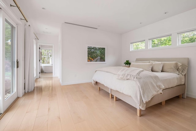 3 Bristol Ln, York, ME 03909 - bedroom with light wood-style floors, baseboards, and access to exterior