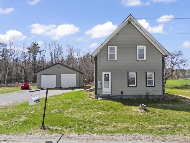1568 Hill Rd, Canaan, ME 04924 - view of side of home featuring a garage, an outdoor structure, and a yard