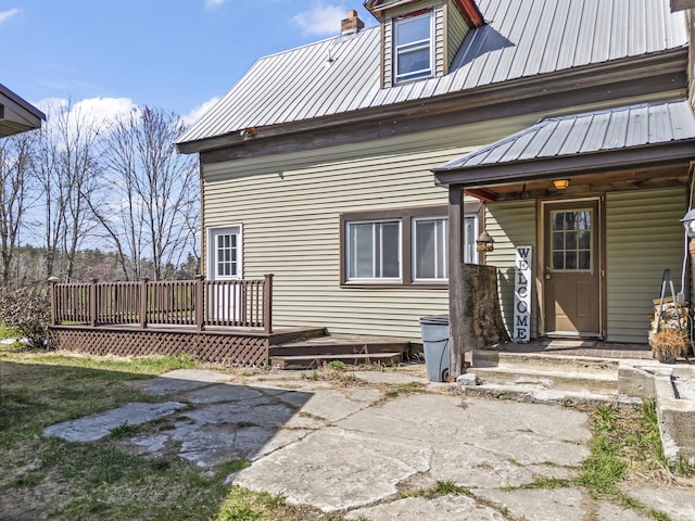 1568 Hill Rd, Canaan, ME 04924 - rear view of property featuring metal roof and a wooden deck