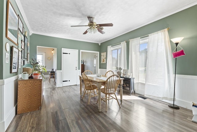 1568 Hill Rd, Canaan, ME 04924 - dining area featuring a wainscoted wall, a ceiling fan, wood finished floors, and crown molding