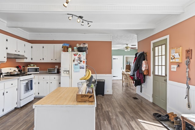 1568 Hill Rd, Canaan, ME 04924 - kitchen featuring white appliances, under cabinet range hood, light countertops, wainscoting, and dark wood finished floors