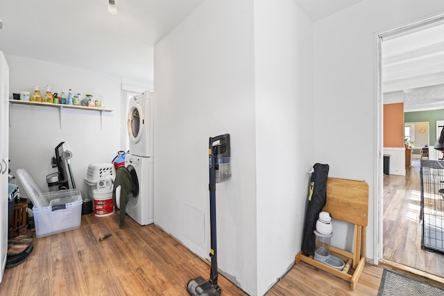 1568 Hill Rd, Canaan, ME 04924 - clothes washing area with stacked washer / dryer and light wood-style flooring