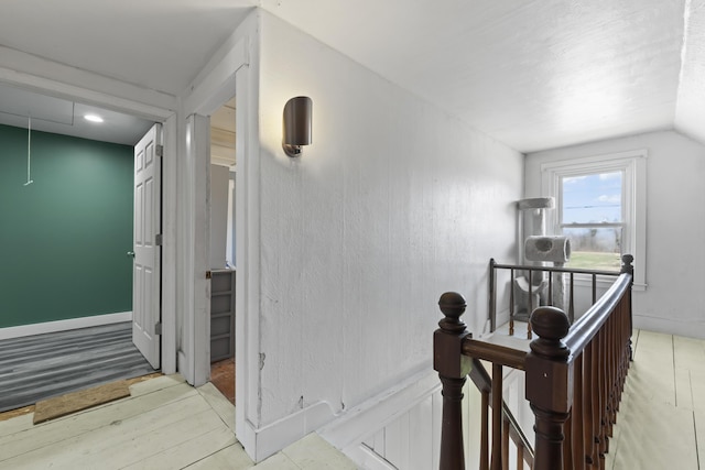 1568 Hill Rd, Canaan, ME 04924 - hall featuring attic access, baseboards, vaulted ceiling, and an upstairs landing