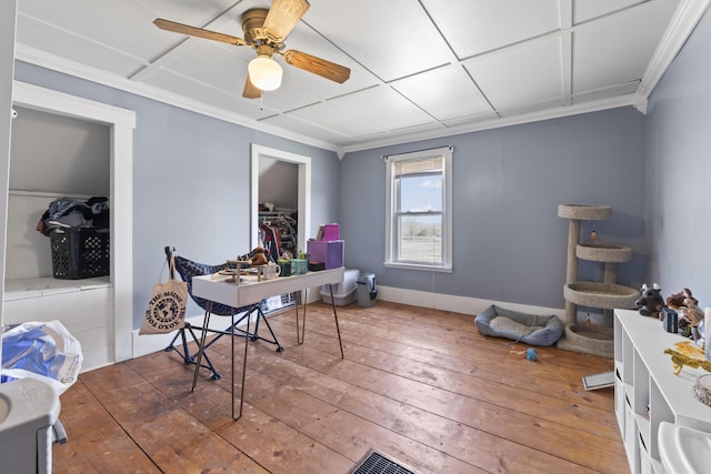 1568 Hill Rd, Canaan, ME 04924 - office space with wood-type flooring, ornamental molding, ceiling fan, and baseboards