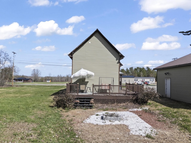 1568 Hill Rd, Canaan, ME 04924 - back of property featuring a wooden deck and a lawn