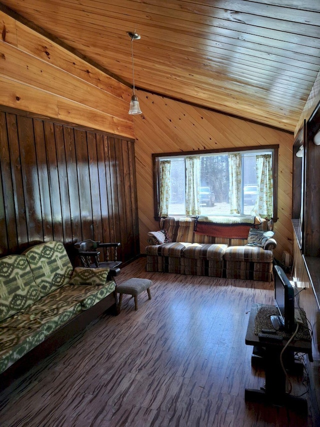 27 Kingman Beach Rd, Osborn, ME 04605 - living area featuring wood walls, lofted ceiling, and wood finished floors