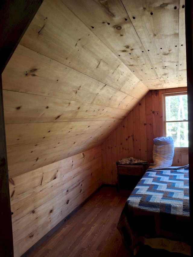 27 Kingman Beach Rd, Osborn, ME 04605 - bedroom featuring wood finished floors, lofted ceiling, wood walls, and wooden ceiling
