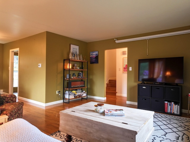 11 Moreau Ave, Lewiston, ME 04240 - living area featuring light wood-type flooring, stairway, and baseboards