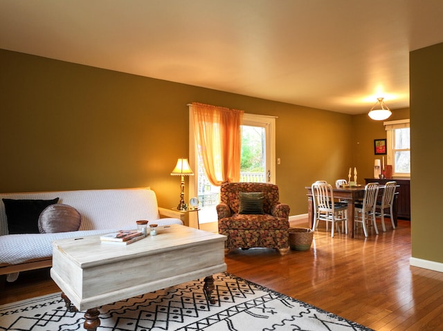 11 Moreau Ave, Lewiston, ME 04240 - living area featuring wood finished floors, plenty of natural light, and baseboards